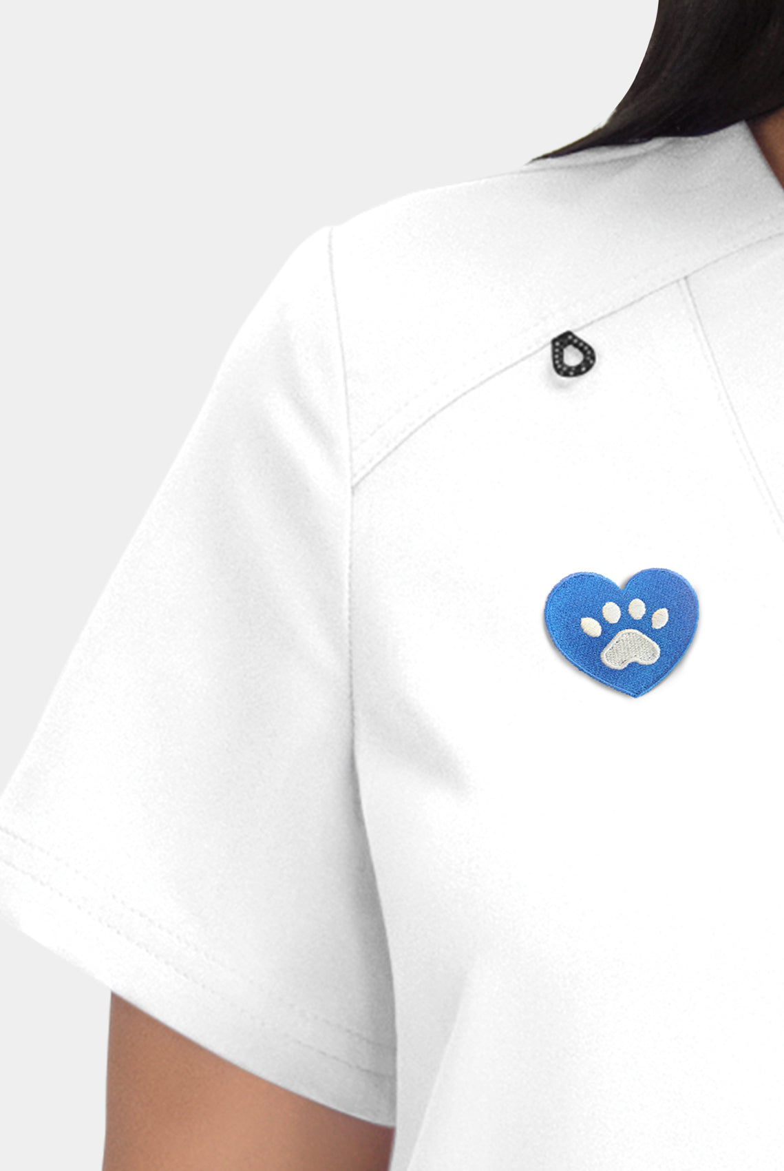 Hustle and Heart white embroidery close-up